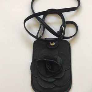 Leather black flower phone pouch.